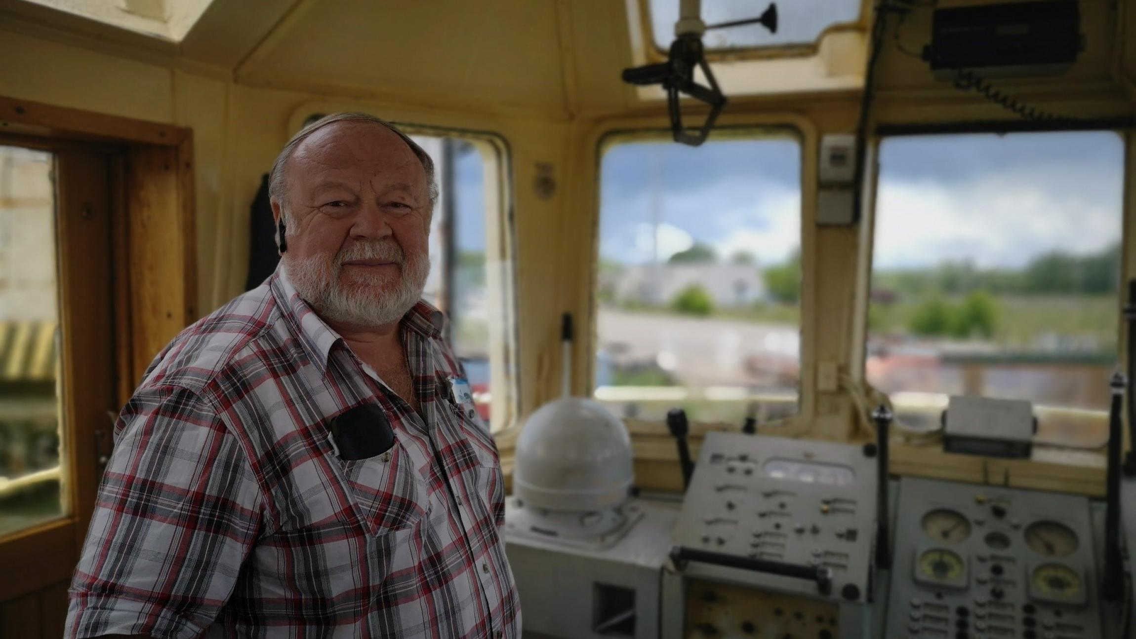 The captain of the Orkāns on the bridge