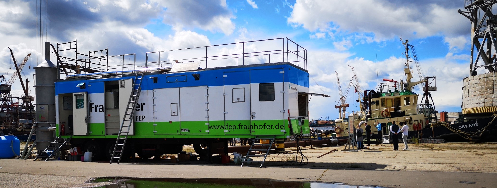 The test area, with the tugboat on the right, the accelerator truck in the center and the scrubber on the left. (Image: ARIES)